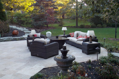Example of a trendy backyard stone patio design in Cincinnati