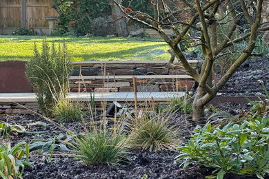 Inspiration for a medium sized traditional back formal full sun garden steps for summer in Other with natural stone paving and a wood fence.