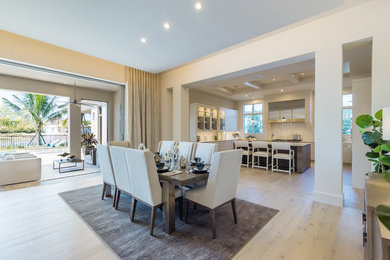 This is an example of a transitional dining room in Miami.