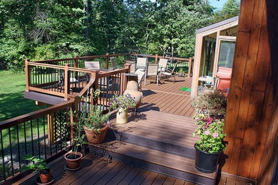 Deck - mid-sized transitional backyard deck idea in Philadelphia with a fire pit and no cover