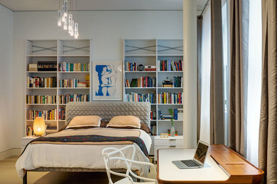Bedroom - contemporary light wood floor bedroom idea in New York with white walls