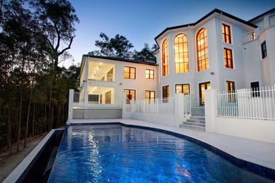 Contemporary two-storey brick white exterior in Brisbane with a hip roof.
