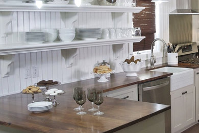 Elegant kitchen photo in Minneapolis with open cabinets, white cabinets, wood countertops, stainless steel appliances and a farmhouse sink