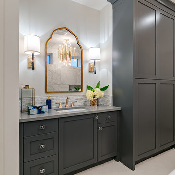 "Hers" vanity with hidden laundry shute!