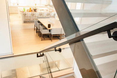 Inspiration for a large modern wooden u-shaped staircase remodel in Boston