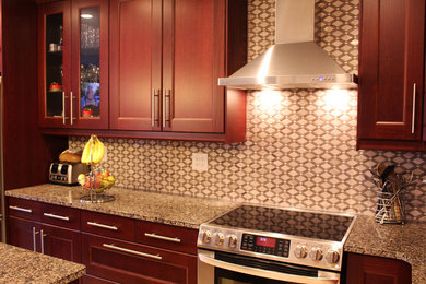 Inspiration for a large modern galley marble floor eat-in kitchen remodel in Toronto with a double-bowl sink, granite countertops, beige backsplash, mosaic tile backsplash, stainless steel appliances and an island