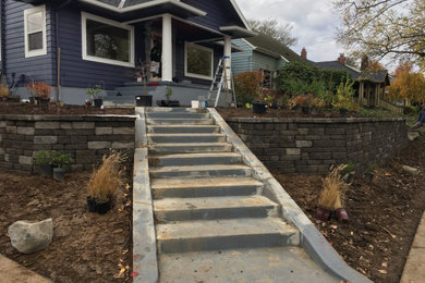 Design ideas for a mid-sized rustic concrete paver landscaping in Portland.