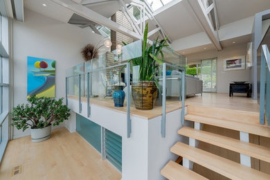Inspiration for a mid-sized modern light wood floor and beige floor hallway remodel in Vancouver