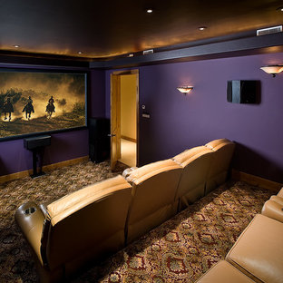 Home theater - large rustic enclosed carpeted and multicolored floor home theater idea in Albuquerque with purple walls and a projector screen