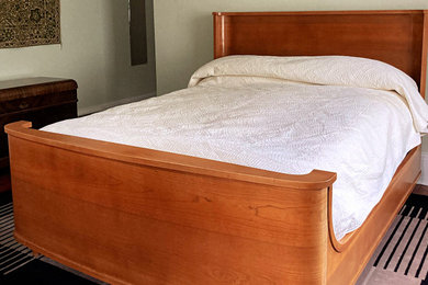 Moss Art Deco Shelter Bed. Queen size in cherry veneer and solid cherry.