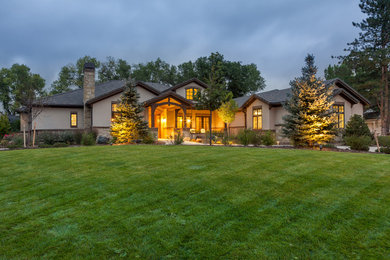 Elegant beige one-story stucco gable roof photo in Denver
