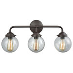 Elk Home - Beckett 3-Light for The Bath, Oil Rubbed Bronze With Clear Glass - Three light oil rubbed bronze bath vanity with clear glass. Can be hung with glass facing up or down. Three 60 watt medium base incandescent or led bulb required, not included. Pictured with filament style bulb, not included.