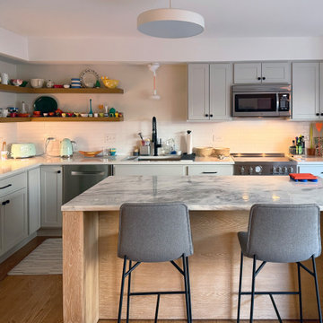 Curated Condo: Eclectic Kitchen, Light Wood Island, Veined Quartz