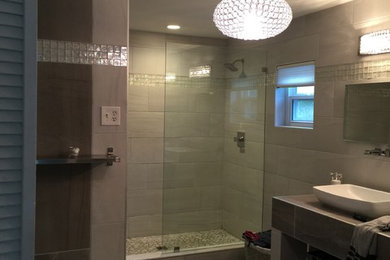 Inspiration for a mid-sized modern master bathroom in Orlando with open cabinets, white cabinets, an alcove shower, beige tile, porcelain tile, beige walls, porcelain floors, a vessel sink, tile benchtops, beige floor and an open shower.