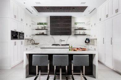 Eat-in kitchen - large contemporary u-shaped porcelain tile, gray floor and tray ceiling eat-in kitchen idea in Miami with an undermount sink, flat-panel cabinets, white cabinets, multicolored backsplash, stainless steel appliances, two islands and multicolored countertops