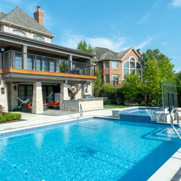 Burr Ridge Lap Pool with Raised Hot Tub and Waterfall