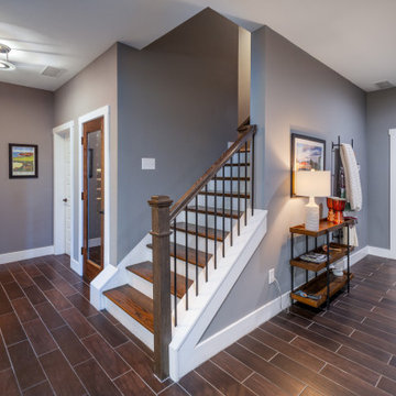 GOLF SIMULATOR, WINE CELLAR, AND BASEMENT BAR
