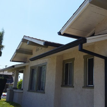 Triple Curve Rain Gutter in Black Aluminum.