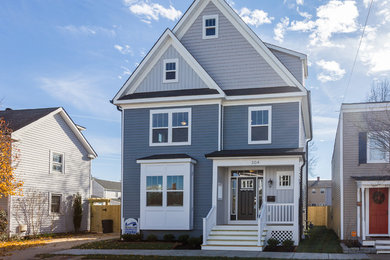 Mid-sized elegant blue three-story concrete fiberboard exterior home photo in DC Metro with a shingle roof