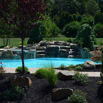 Custom Pools & Spas, Outdoor Kitchens, Patios & Walkways, and Plantings