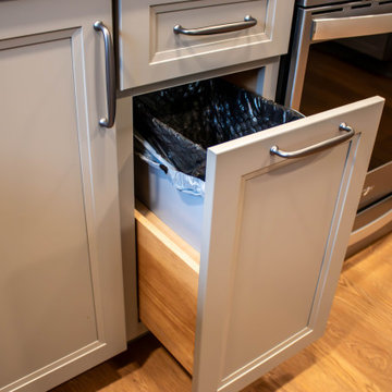 Two-Tone Neutral Kitchen with Quartz Countertop and Soho Picket Backsplash