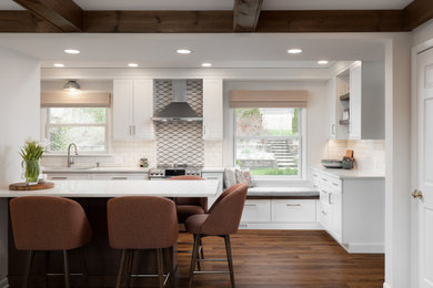 Inspiration for a mid-sized transitional galley brown floor and exposed beam kitchen remodel in Detroit with quartzite countertops, white backsplash, an island and white countertops