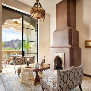 This is an example of a mediterranean living room in Other with beige walls and a standard fireplace.