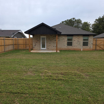 Backyard with sprinkler system and bermuda sod