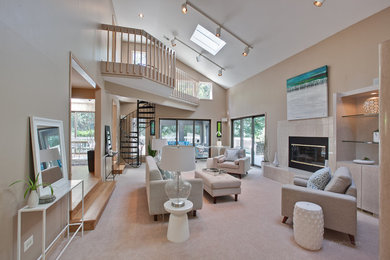 Family room - large transitional open concept carpeted and gray floor family room idea in Kansas City with beige walls, a standard fireplace, a tile fireplace and no tv