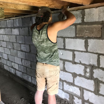 Failing foundation wall replacement and waterproofing