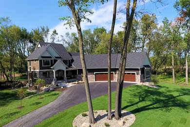 Example of a brown two-story concrete fiberboard gable roof design in Minneapolis