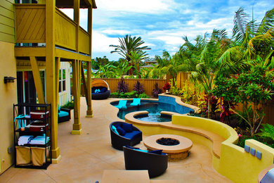 Example of a trendy backyard concrete and custom-shaped lap pool design in San Diego