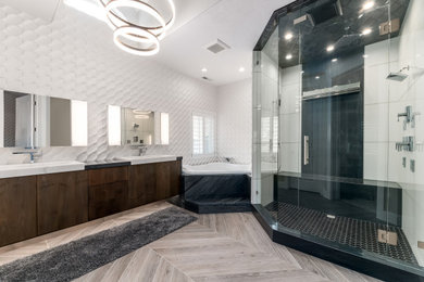 Large trendy master white tile and porcelain tile wood-look tile floor, multicolored floor, double-sink and vaulted ceiling bathroom photo in Salt Lake City with flat-panel cabinets, brown cabinets, a one-piece toilet, gray walls, a vessel sink, granite countertops, a hinged shower door and a floating vanity