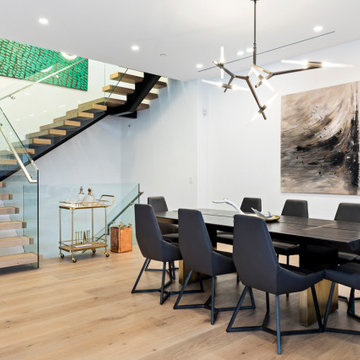 Beverly Hills Open Dining Area with Floating Staircase and Modern Lighting