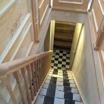 DURING the remodel, we erected panels and added molding and balusters