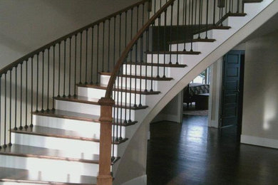 Inspiration for a large craftsman wooden floating staircase remodel in Seattle with wooden risers