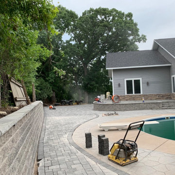 Large pool patio and wall with raised patio
