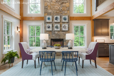 Mid-sized country open plan dining in Boston with a stone fireplace surround.