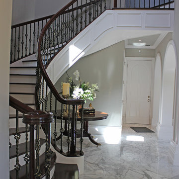 Walnut Circular Stair with Twist & Basket Iron Balusters