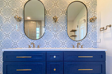 Freestanding bathtub - mid-sized transitional blue tile and porcelain tile porcelain tile, gray floor and double-sink freestanding bathtub idea in Chicago with shaker cabinets, blue cabinets, a two-piece toilet, white walls, an undermount sink, quartz countertops, a hinged shower door, white countertops and a niche