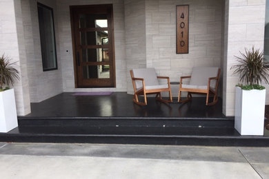 This is an example of a transitional porch design in Other.
