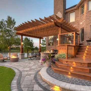 Cobblestone Landscape Renovation with Paver Pool Deck, Pergola, Outdoor Kitchen