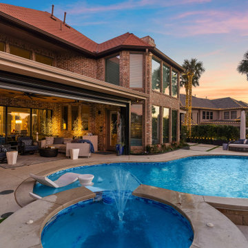 Custom Outdoor Living Pool Deck with Stamped Concrete & Turf