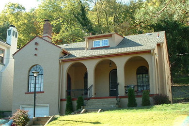 Example of a beige exterior home design in Other