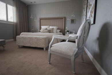 This is an example of a mid-sized contemporary master bedroom in Adelaide with beige walls, carpet, beige floor and wallpaper.