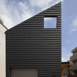 東京23区のコンテンポラリースタイルのおしゃれな家の外観 (黒い外壁、片流れ屋根、アパート・マンション) の写真