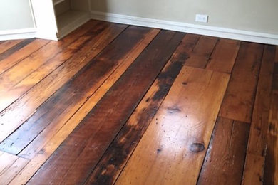 Inspiration for a mid-sized rustic formal and enclosed dark wood floor living room remodel in Philadelphia with beige walls, no fireplace and no tv