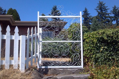 Small contemporary green split-level stucco exterior home idea in Seattle with a hip roof
