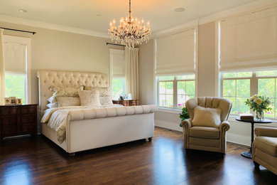 Example of a huge arts and crafts master dark wood floor and brown floor bedroom design in Nashville with beige walls