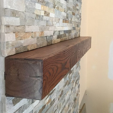 Ben's stacked stone fireplace with reclaimed wood mantle